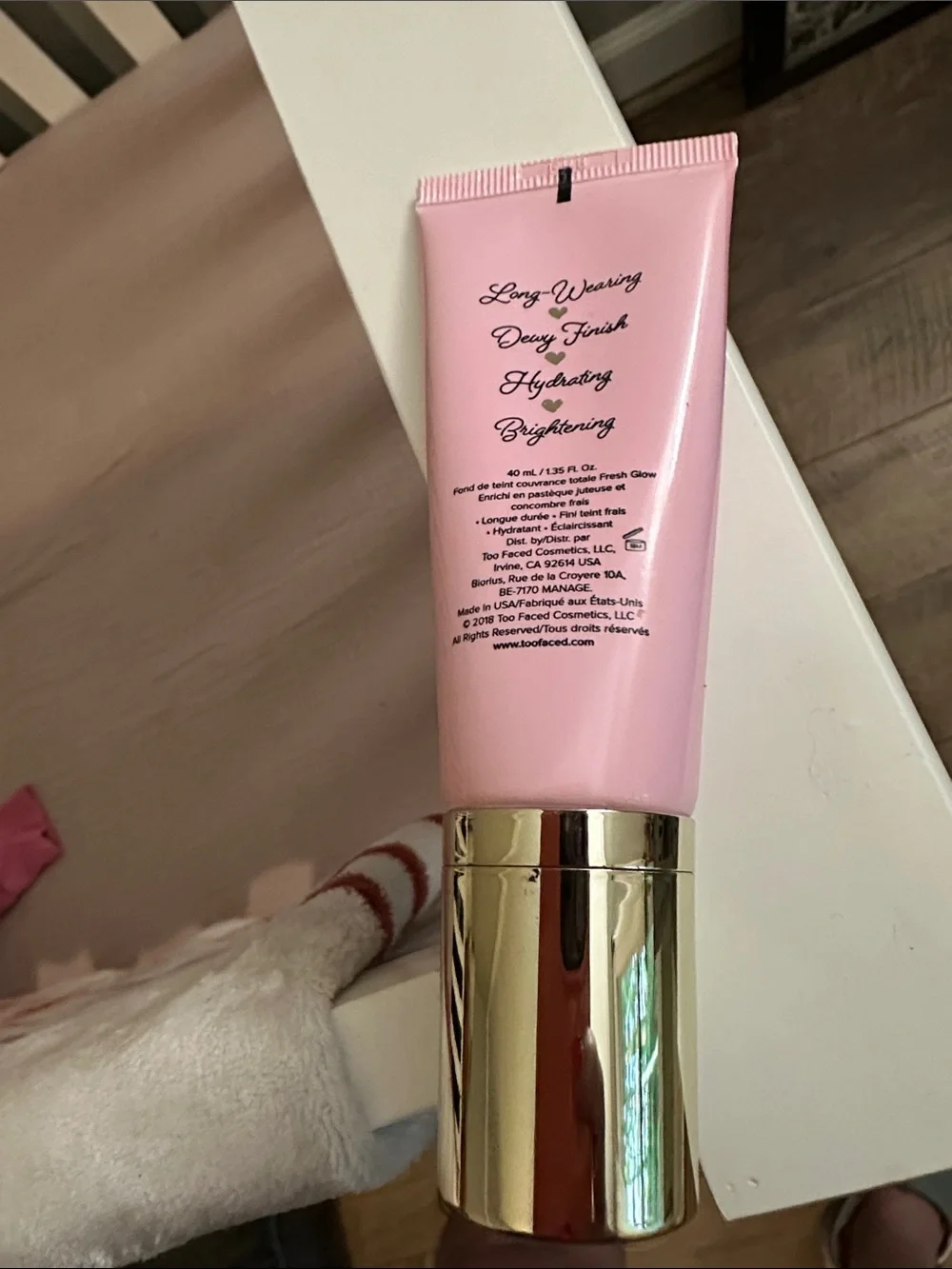 Too Faced Dew You Foundation - Pink & Gold Packaging maple in color